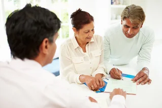 three people reviewing information