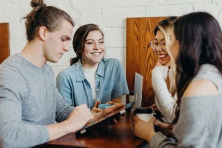 group laughing in a meeting