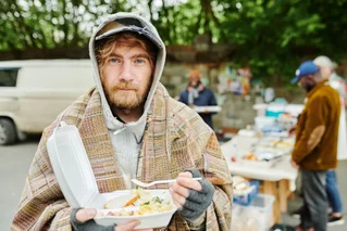 homeless man getting food